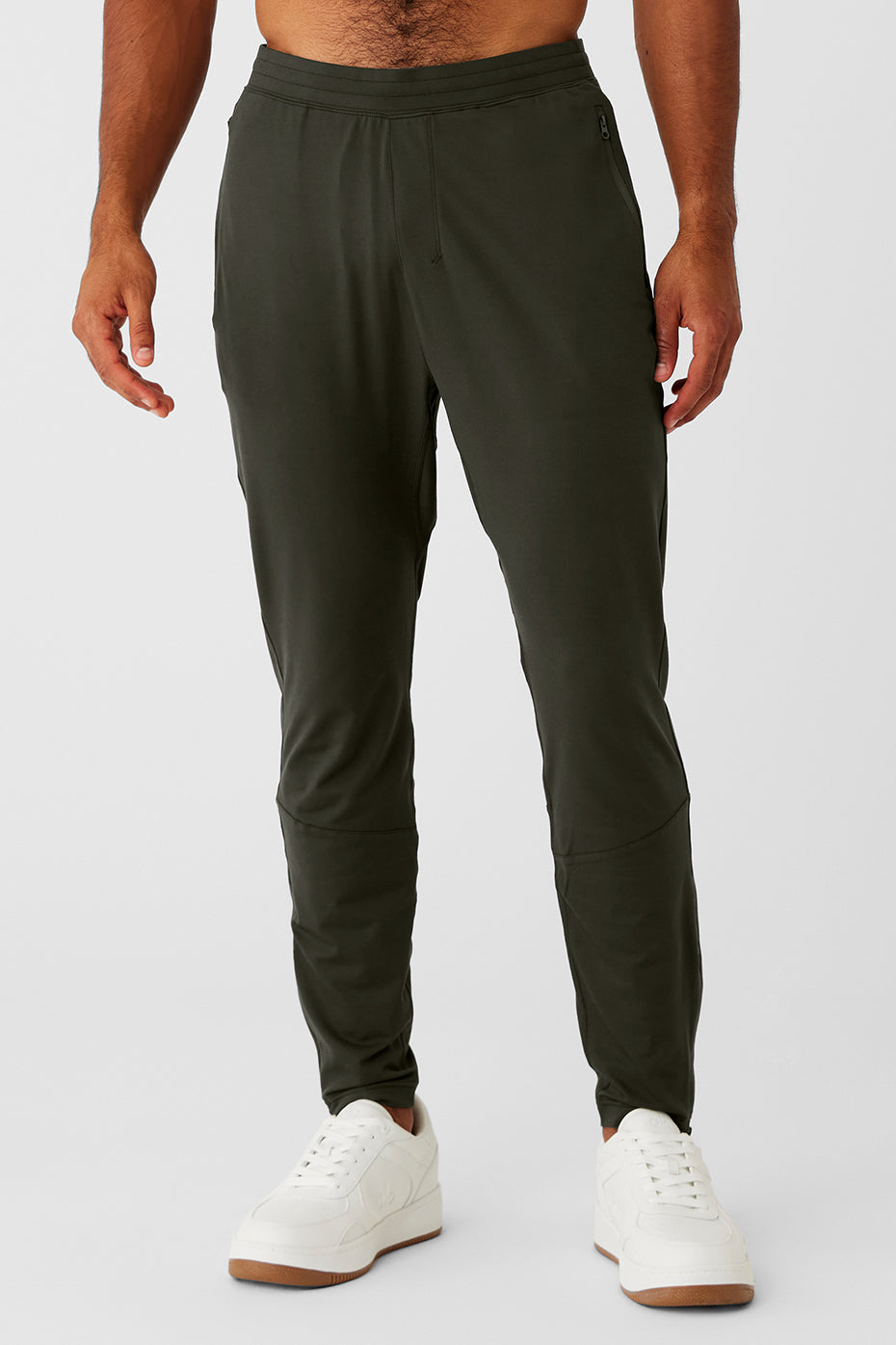 Front view of Conquer React Performance Pants in Stealth Green, showcasing breathable fabric.