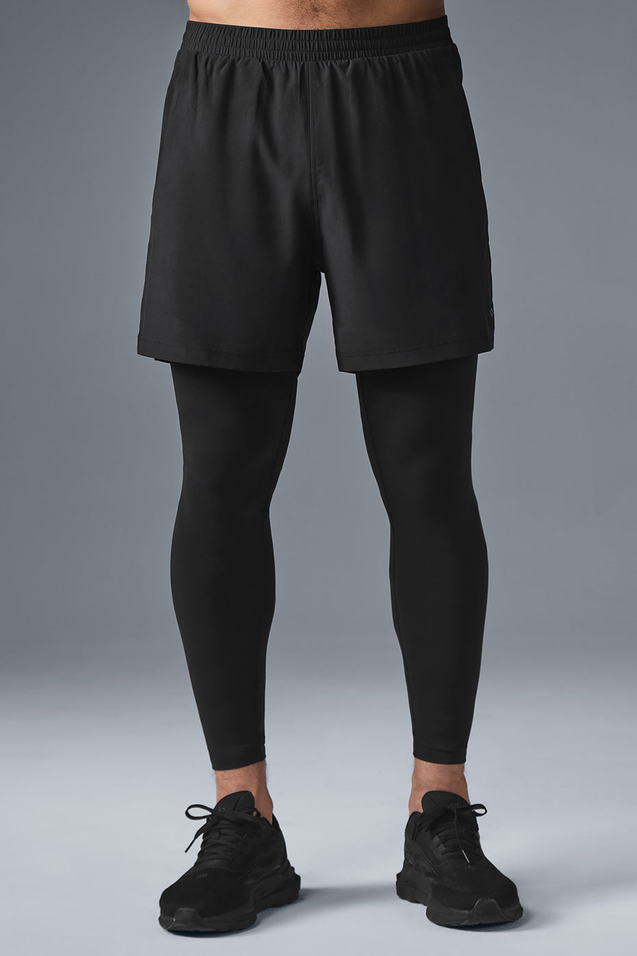 Side view of Revival 2-in-1 running pants highlighting zippered pockets.