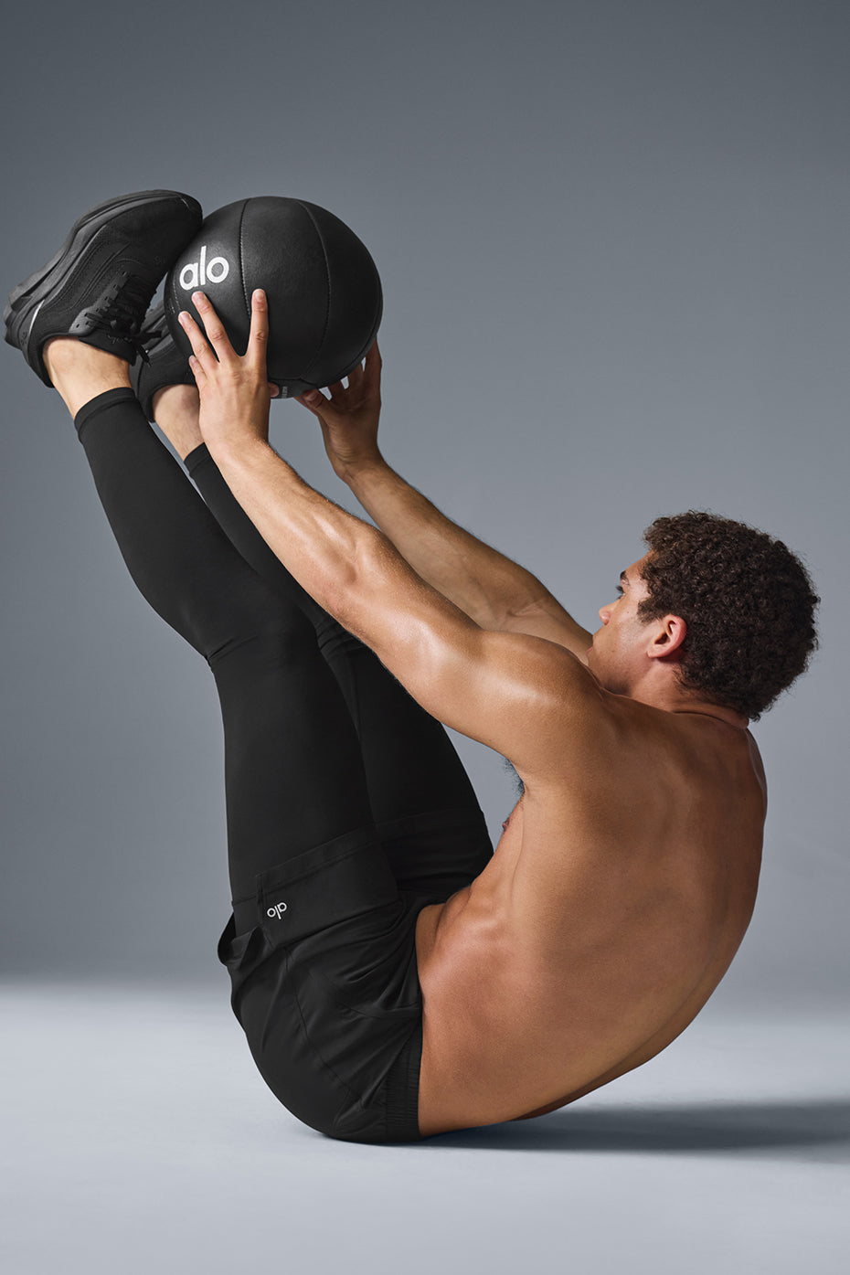 Side view of Revival 2-in-1 running pants highlighting zippered pockets.
