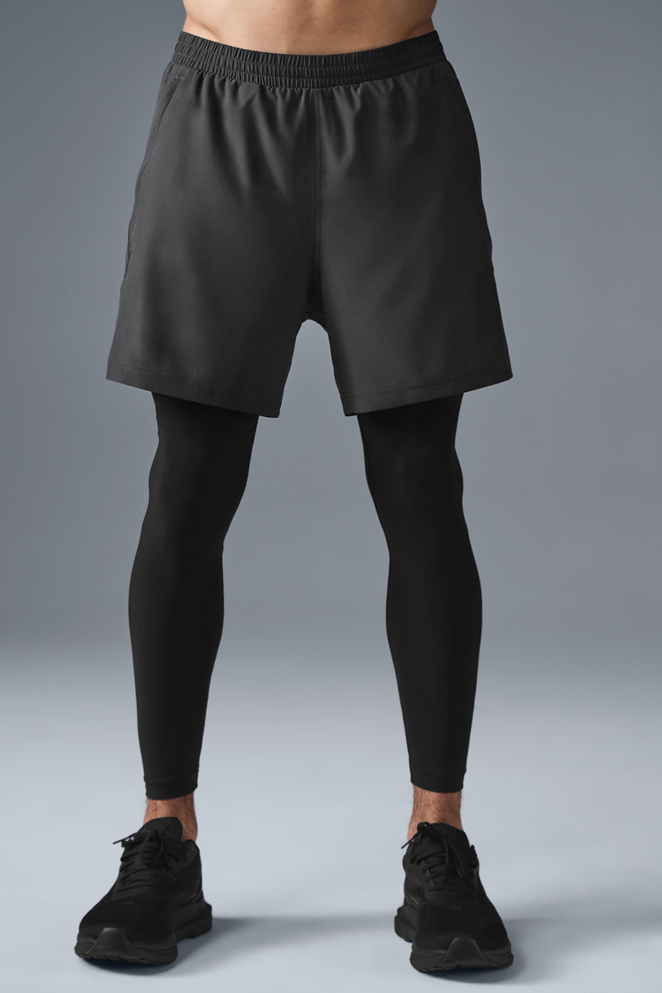 Side view of women in 2-in-1 Revival running shorts, highlighting the zippered pockets.