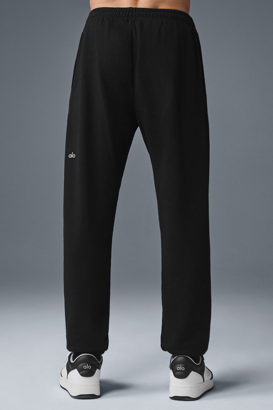 Side view of mens sweatpants with zippered pockets, perfect for workouts.