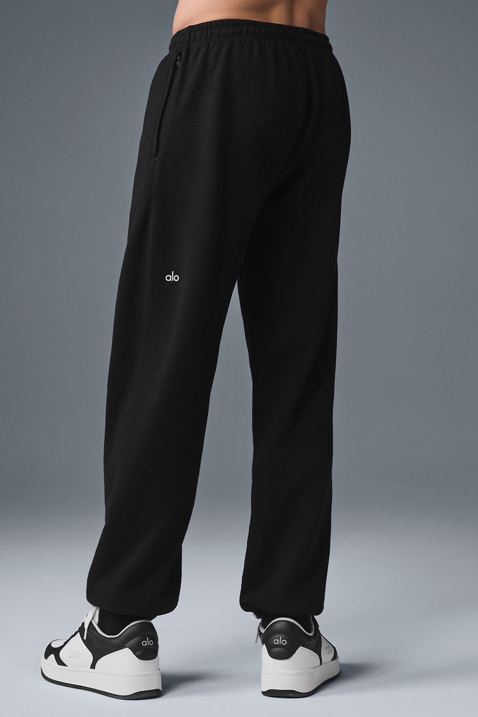 Casual look featuring grey sweatpants paired with a stylish top.