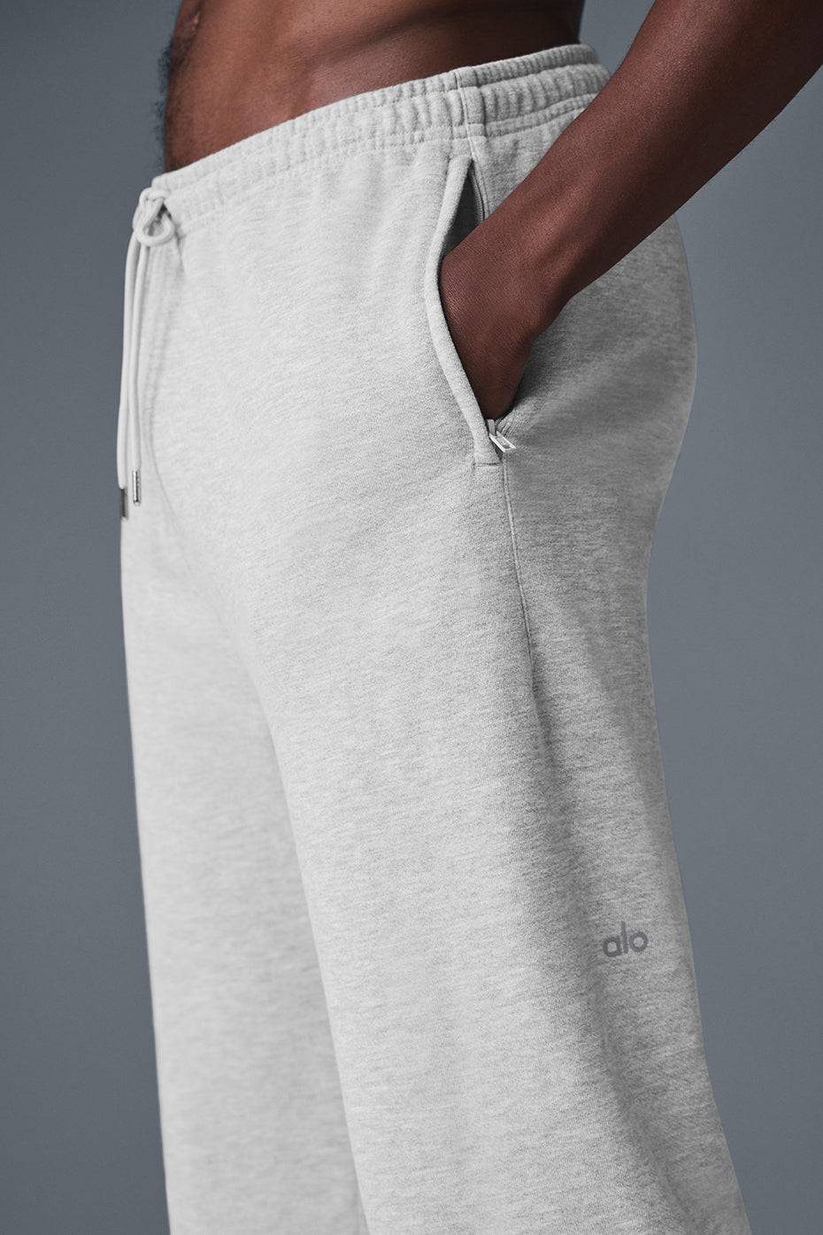 Close-up of camo sweatpants fabric texture and side pocket detail