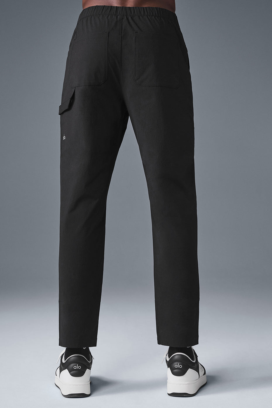 Side view showcasing the zippered pockets of the carpenter pants.