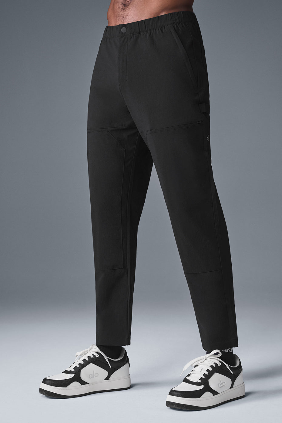 Back view highlighting the sleek design and fit of the track pants.