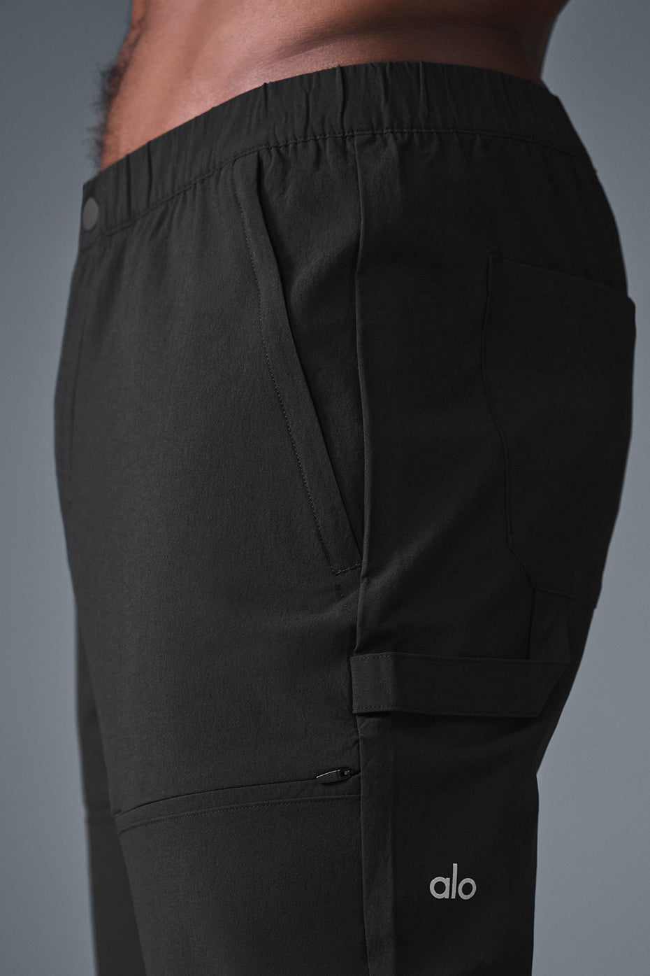 Front view of black cargo pants with hammer loop detail.