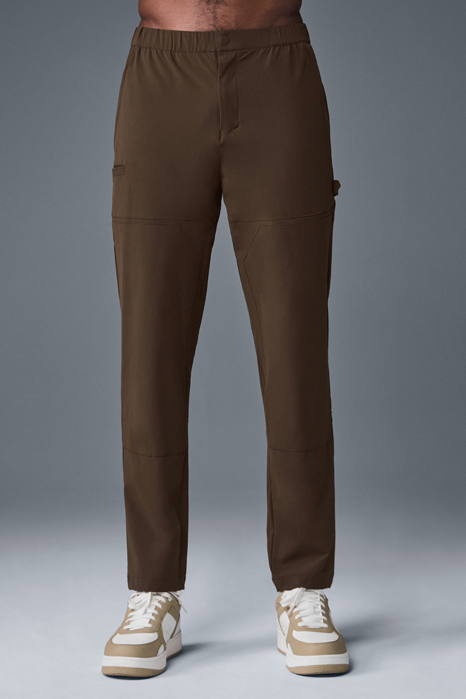 Close-up of black cargo pants with multiple pockets and cargo paneling for outdoor work