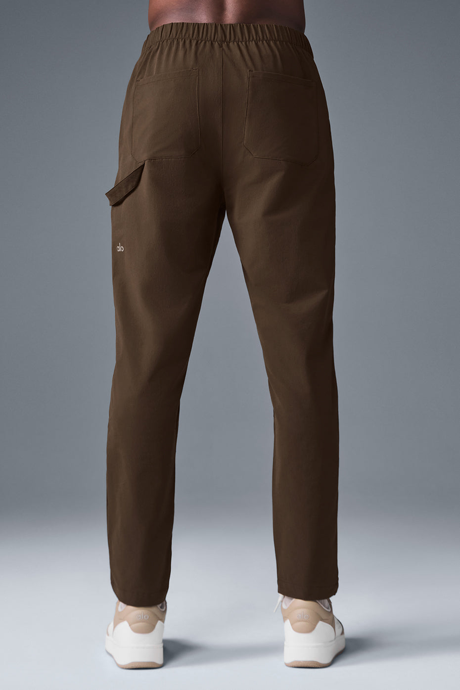 Model wearing Co-Op Carpenter Track Pants showing straight-leg fit and functional design