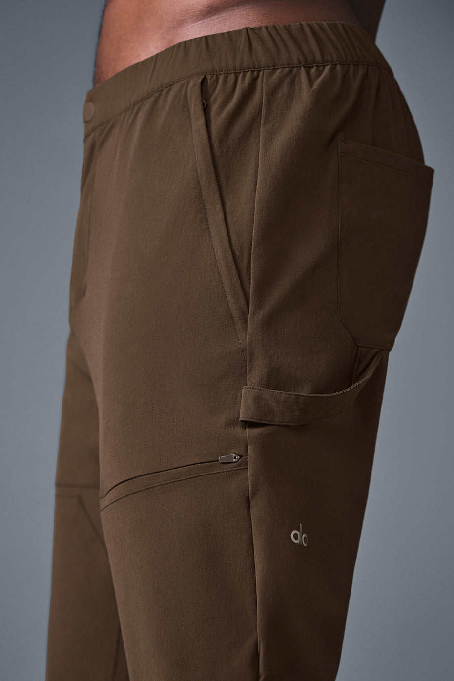 Close-up of black cargo pants with multiple pockets and cargo paneling for outdoor work