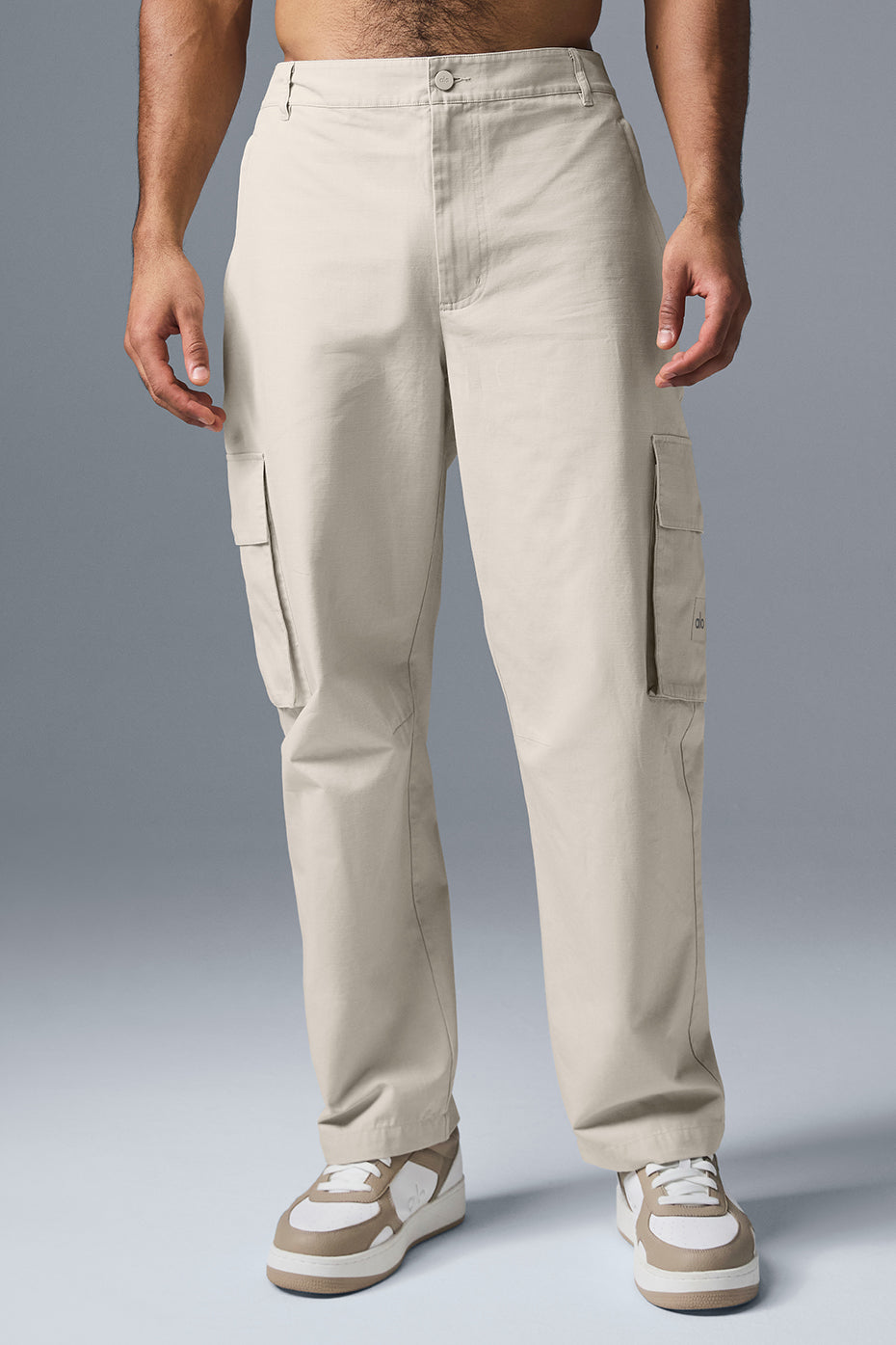 Front view of versatile ripstop cargo trousers in bone color.
