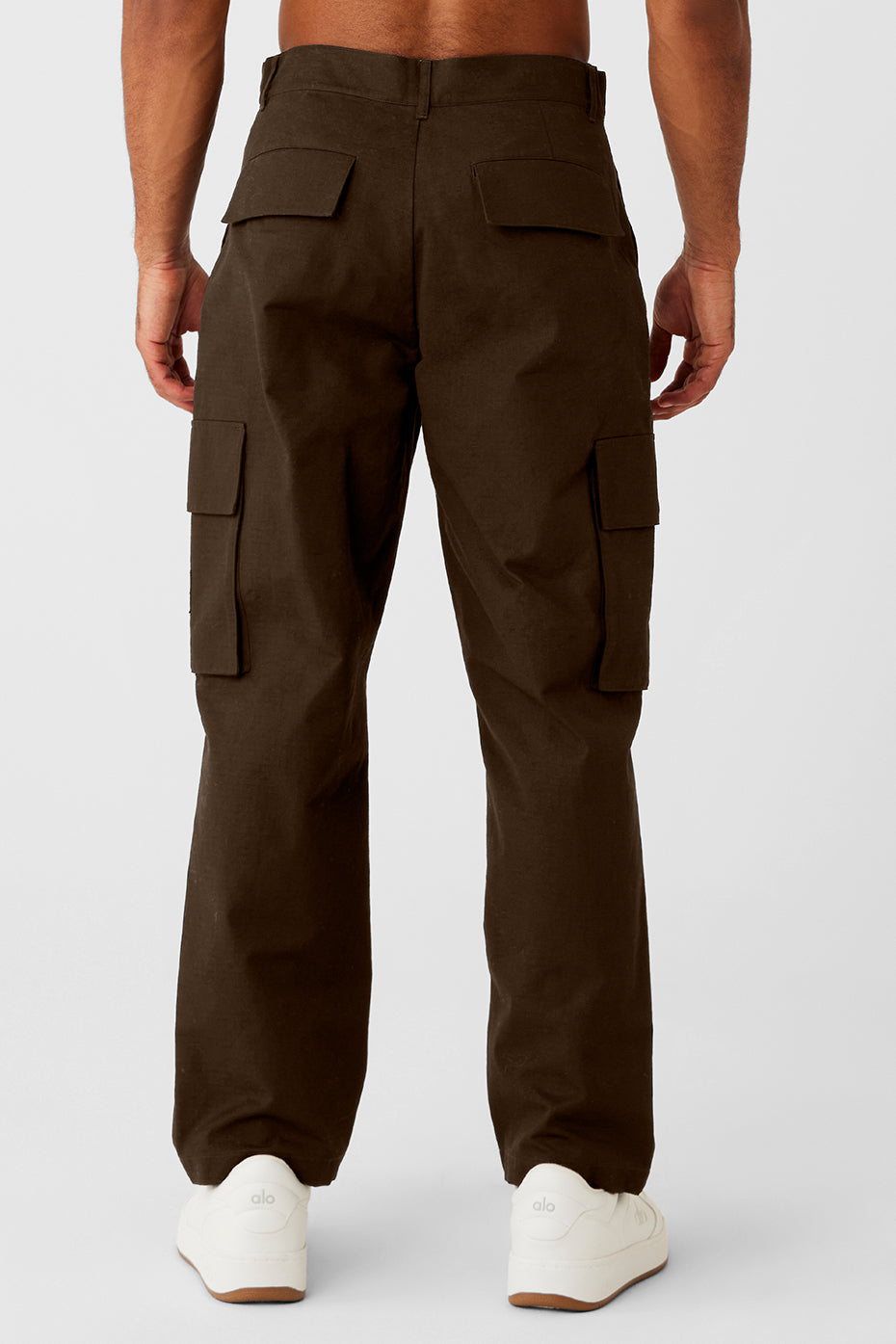 Close-up of the zipper and pockets on the black cargo pants.