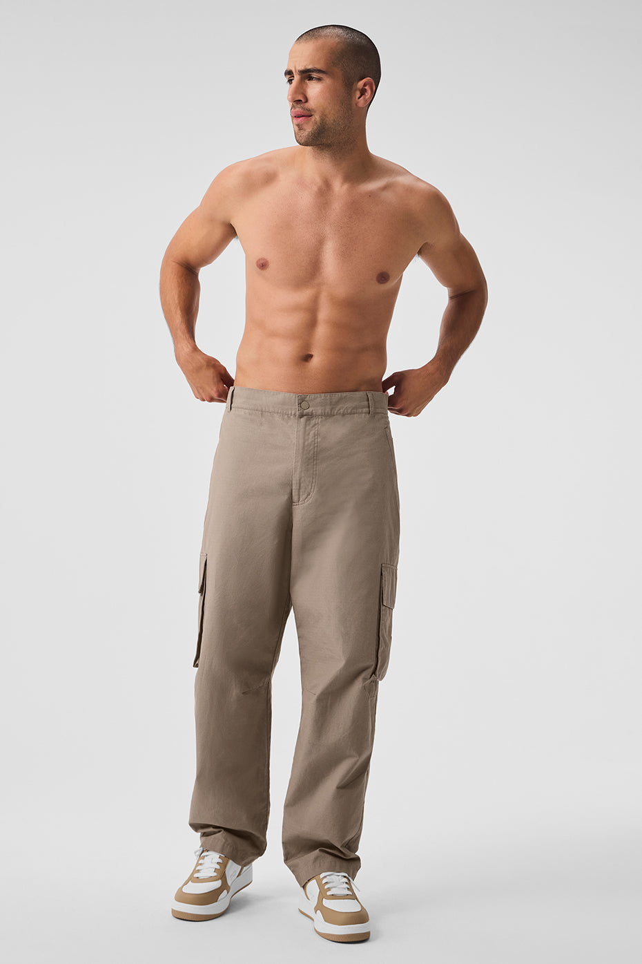 Close-up of the durable ripstop fabric in gravel color on mens cargo trousers