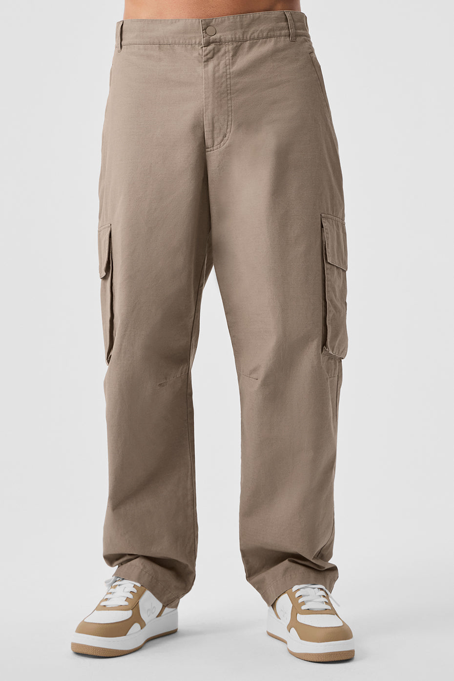 Model wearing Vuori ripstop cargo pants with side pockets for outdoor adventures