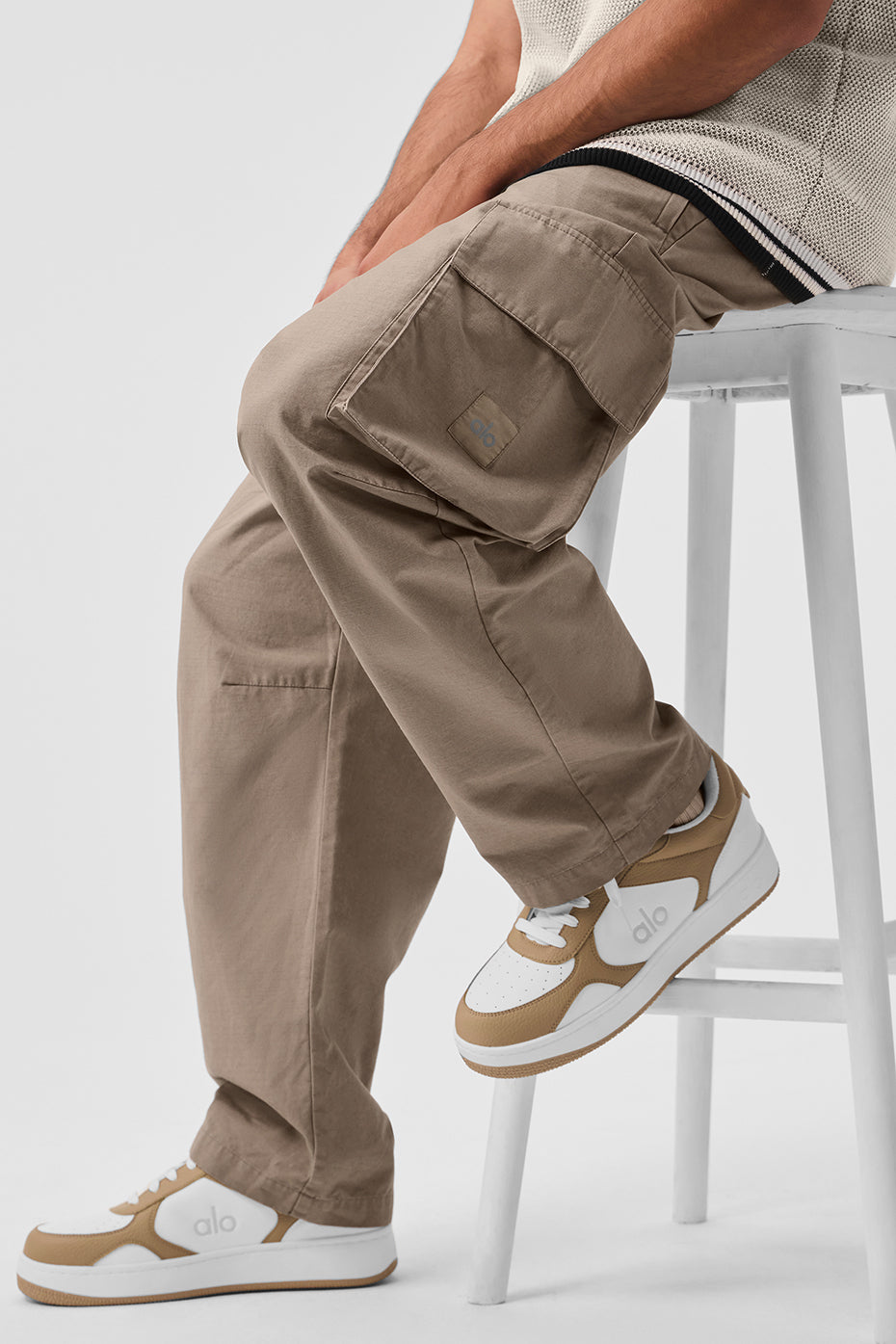 Close-up of the durable ripstop fabric in gravel color on mens cargo trousers