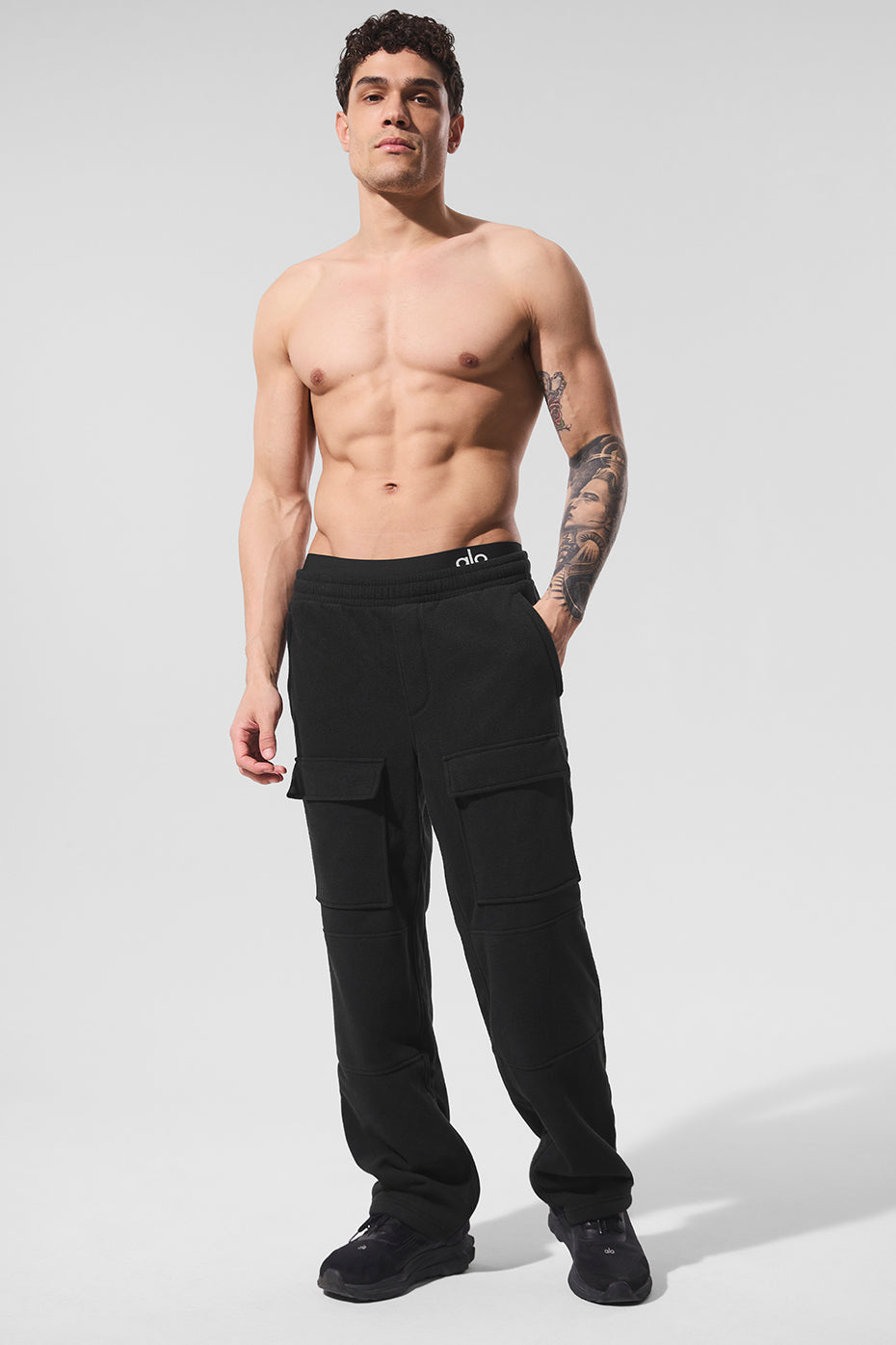 Side view of fleece cargo pants with zip pockets for outdoor wear