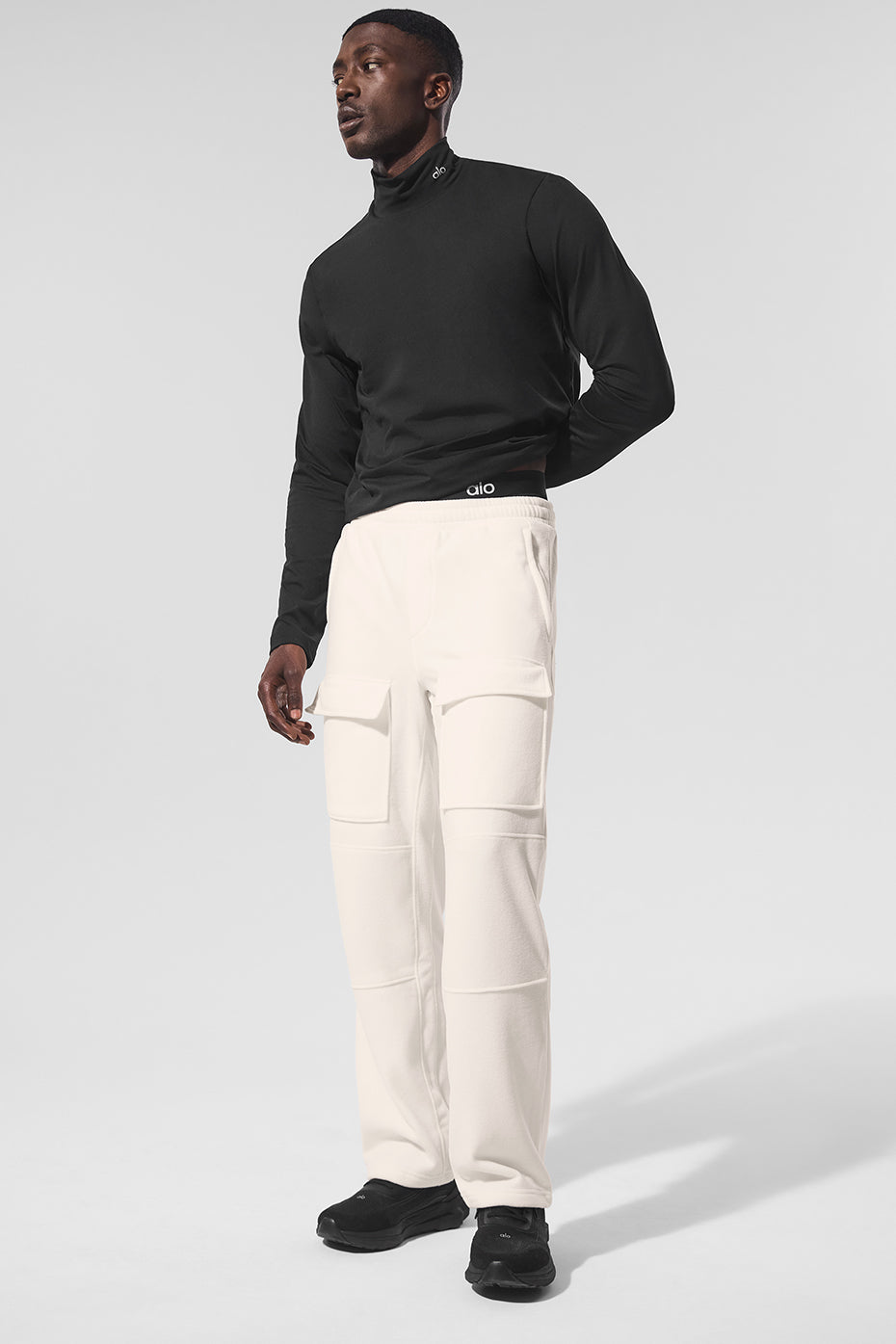 Front view of ivory fleece lined cargo pants with pockets