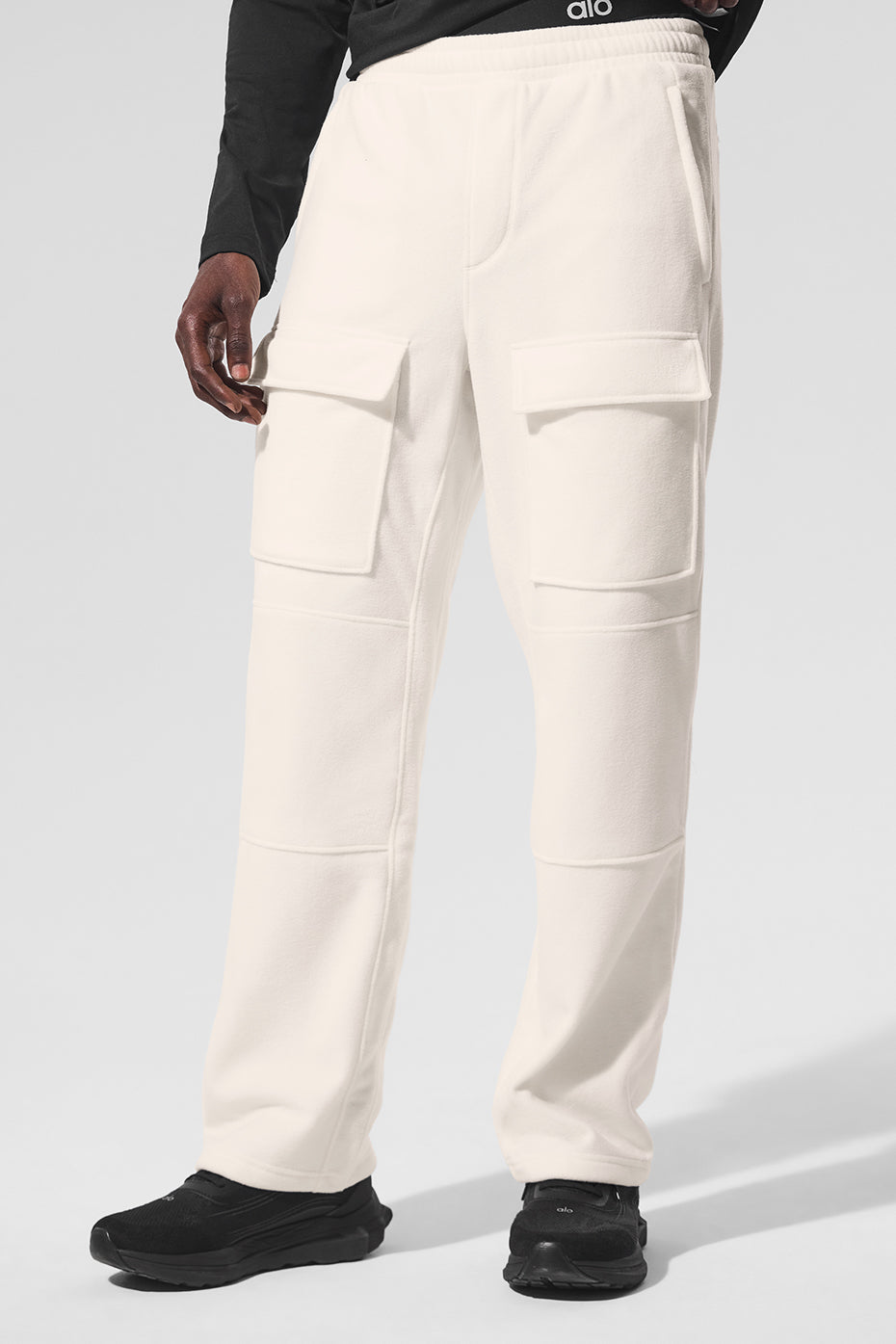Front view of ivory fleece lined cargo pants with pockets