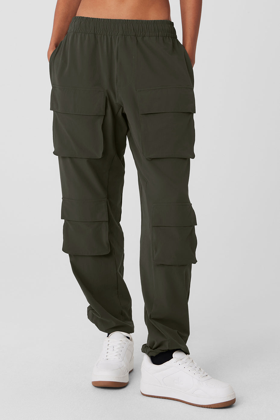 Front view of stealth green camo cargo pants with bungee hem detail