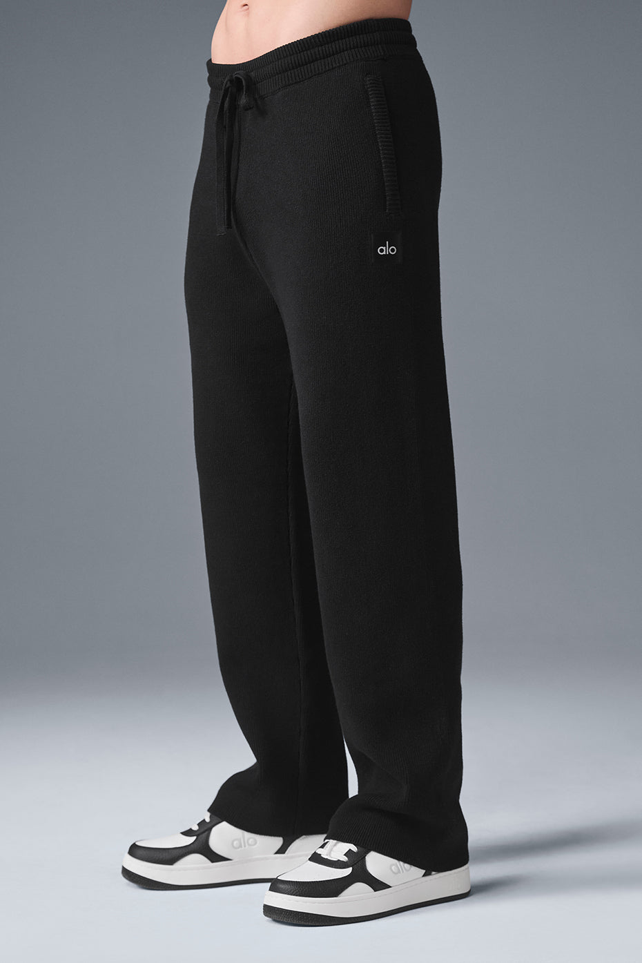 Casual outfit featuring camo wide leg sweatpants paired with a stylish top.