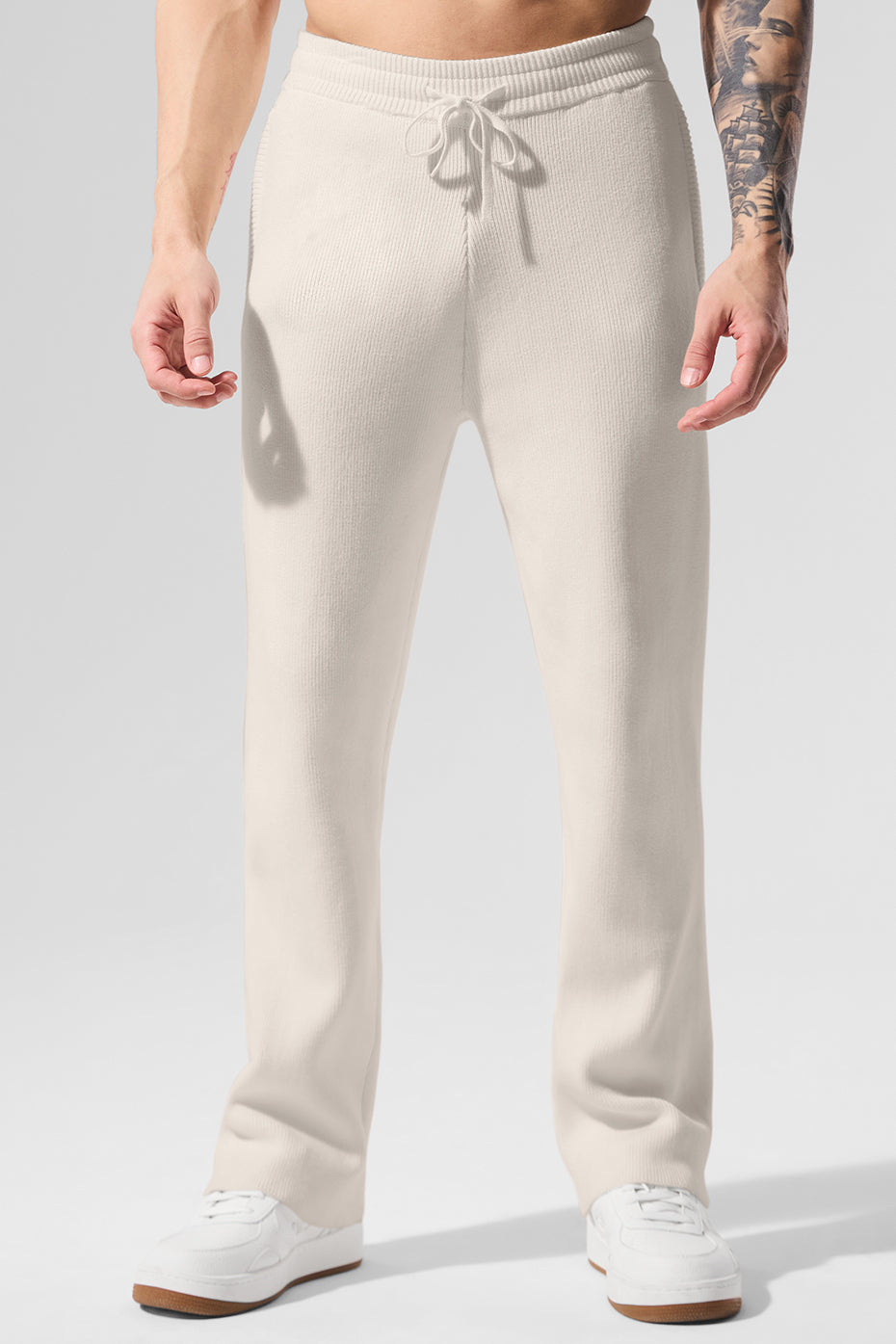 Model wearing Scholar joggers in urban setting