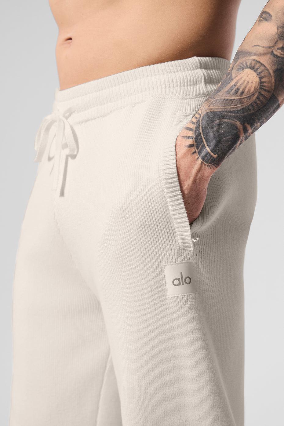 Side view showcasing zippered pockets