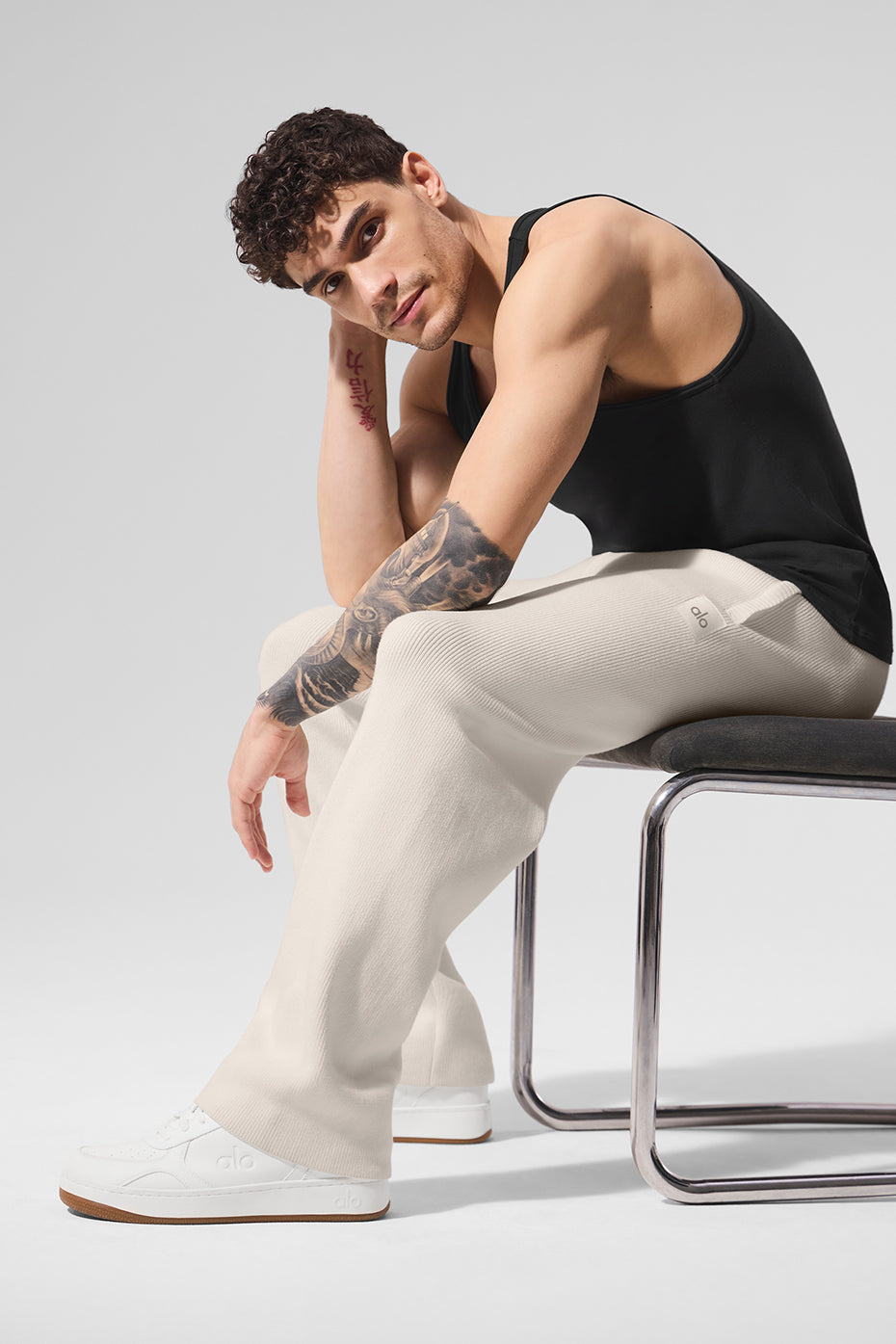 Model wearing Scholar joggers in urban setting