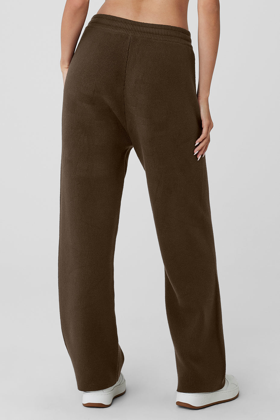 Side view showcasing the drawcord and zippered pockets.