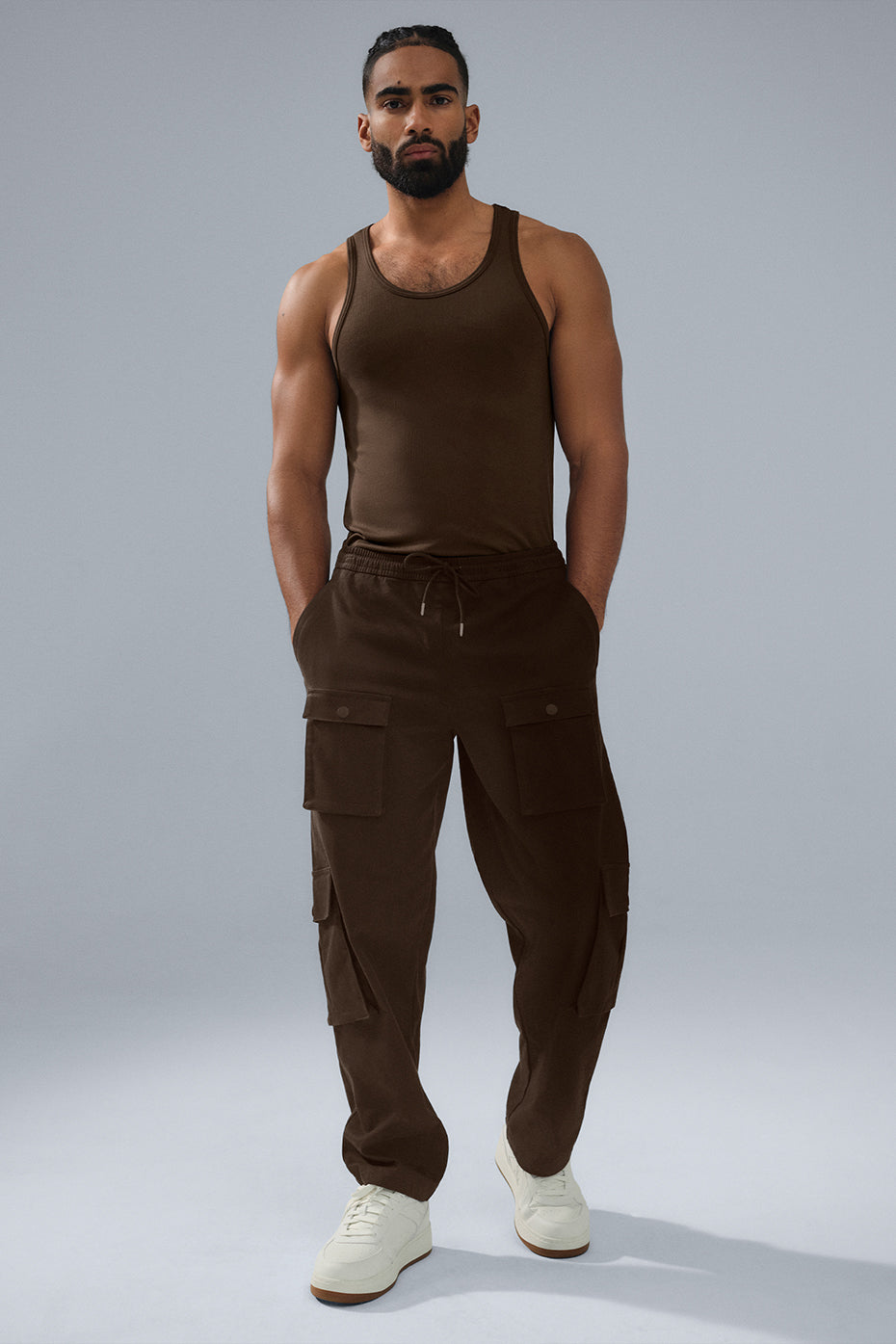 Front view of espresso stretch cargo pants with snap pockets and relaxed fit