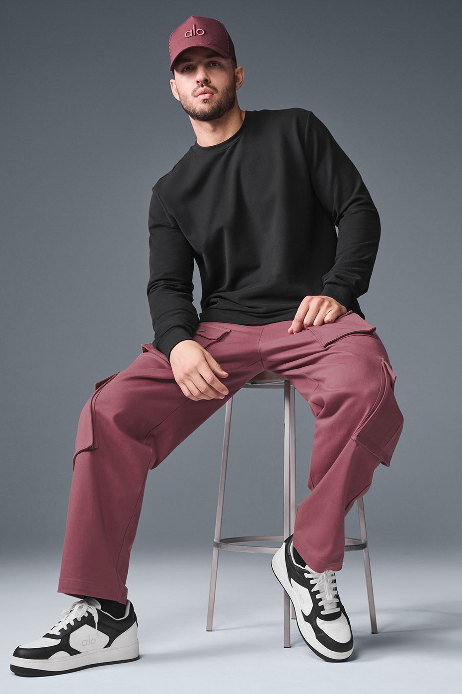 Casual look featuring Burgundy Truffle Cargo Pants and a hoodie.