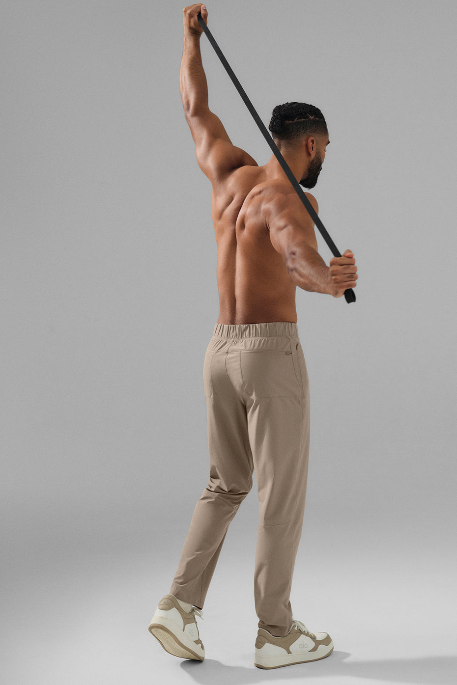 Side view of athletic joggers, highlighting darting details and draw cords.