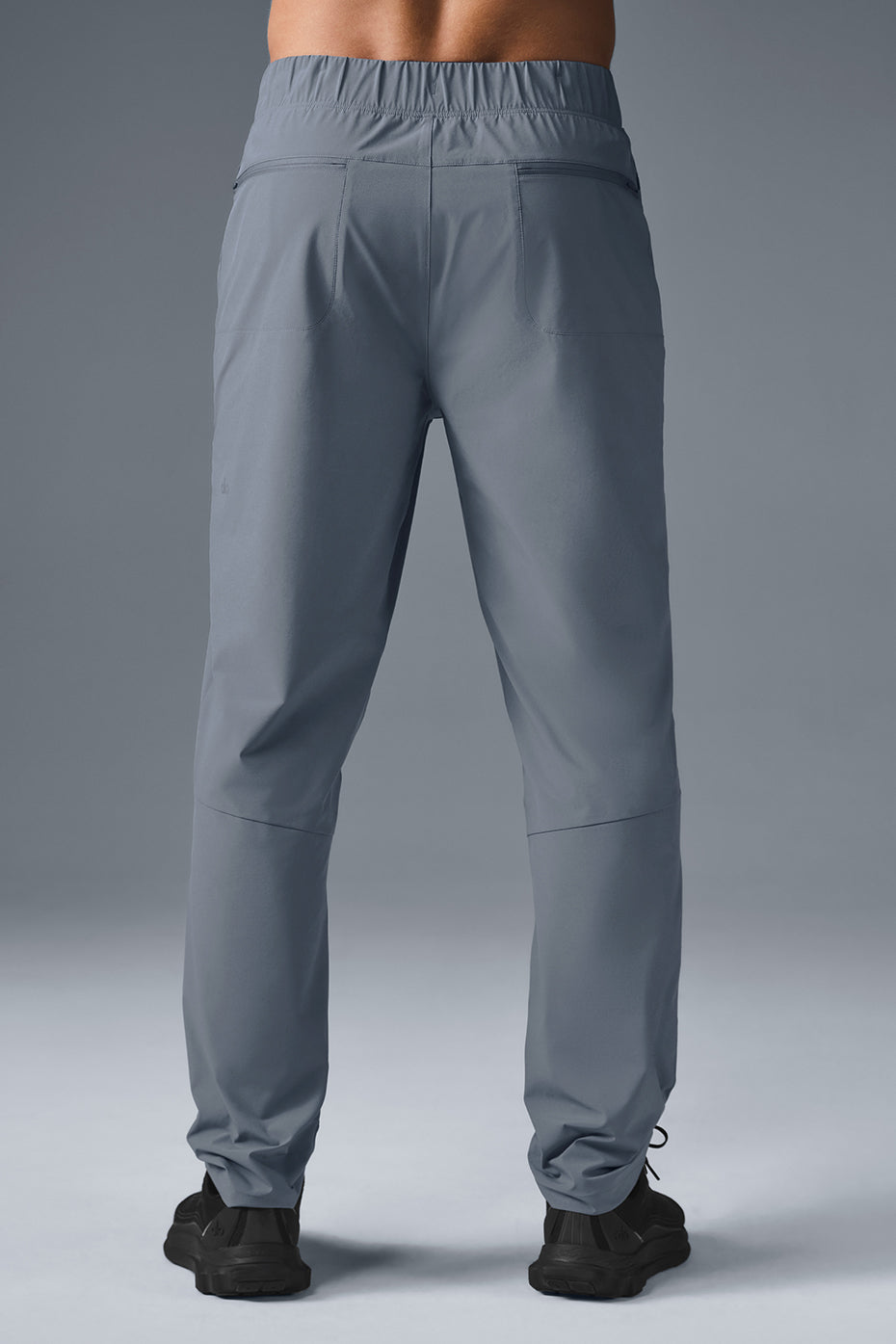 Close-up of tailored athletic pants with draw cords for a perfect fit.