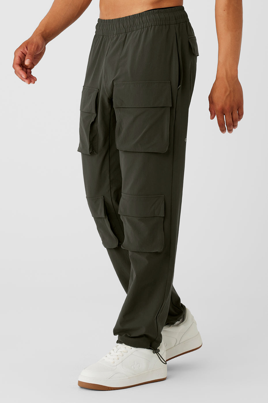 Stealth green pants folded to show water-repellent finish and adjustable hem