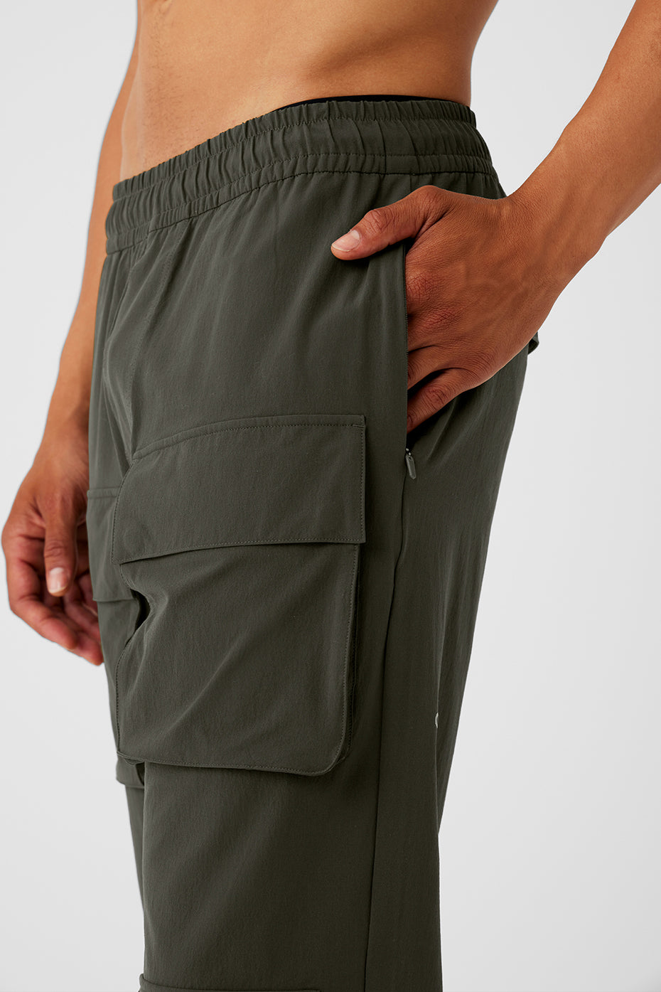 Close-up of mens water repellent pants highlighting cargo pockets and stitching detail