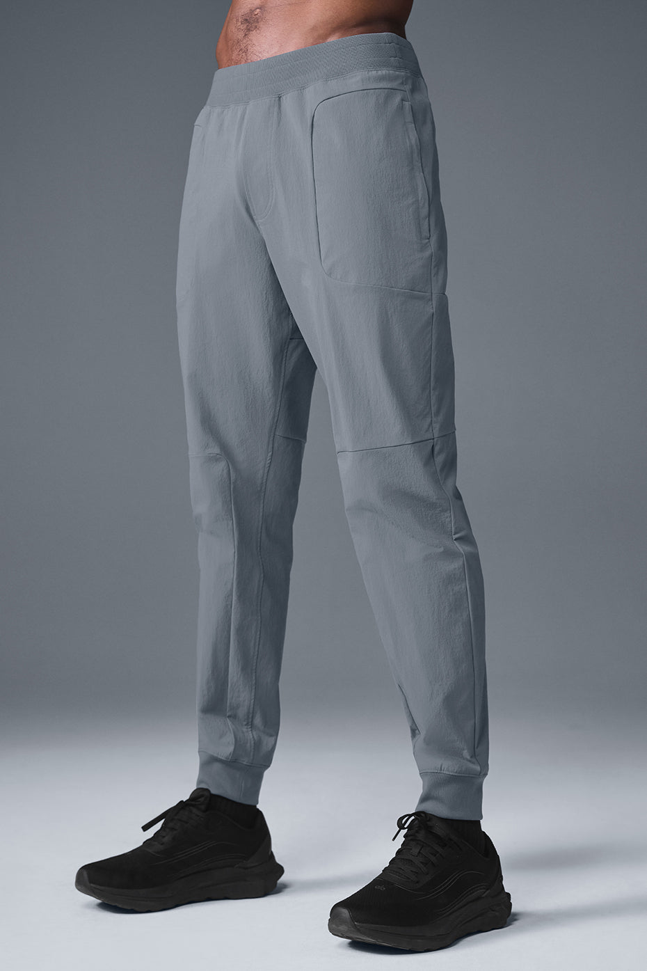 Detail shot of elastic waistband and zippered pockets