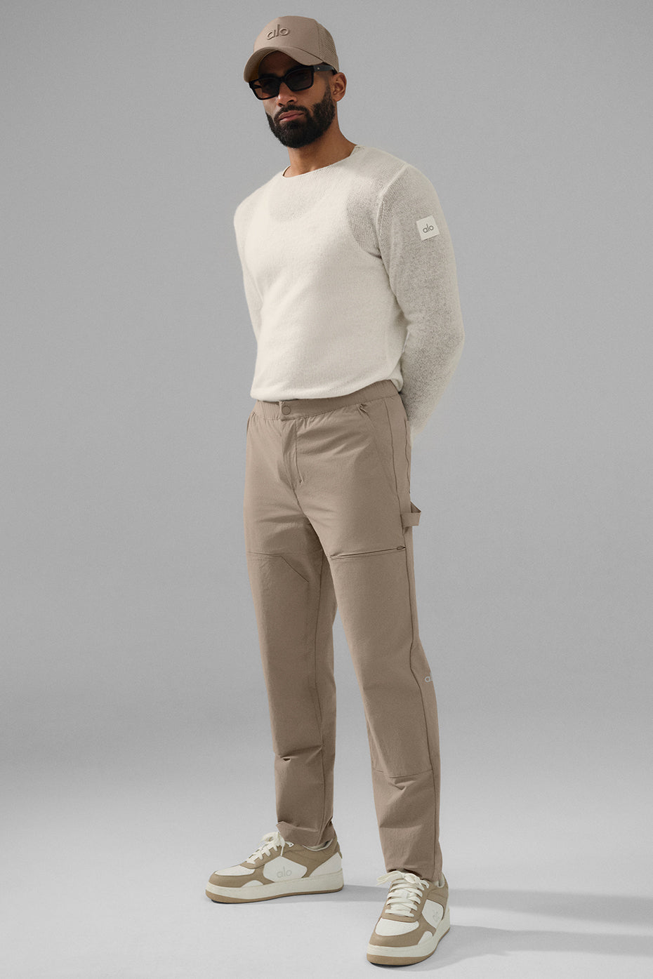 Side view of carpenter pants showing cargo pockets and zippered detail.