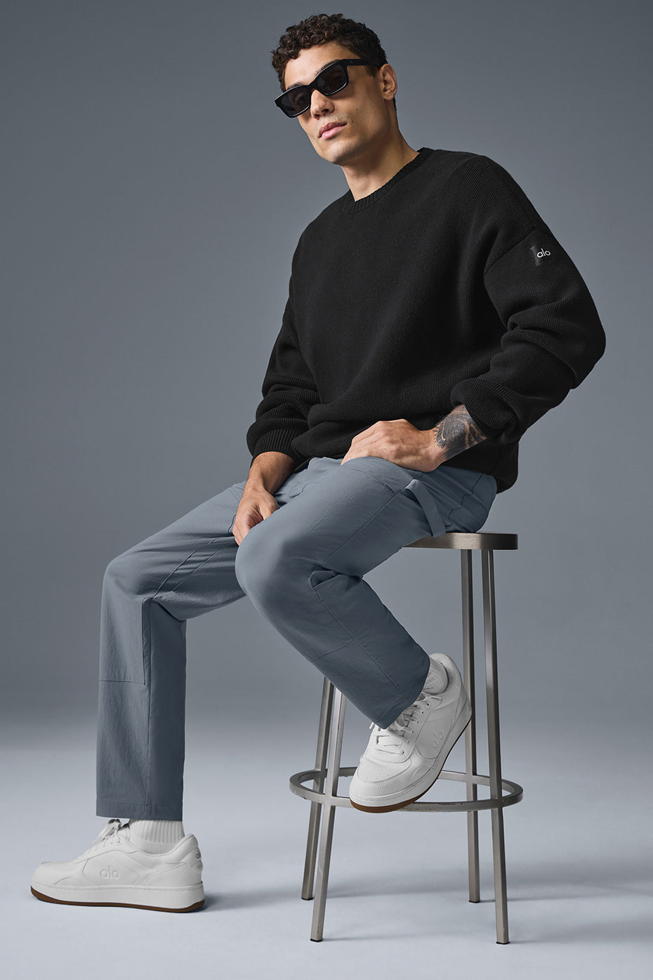 Front view of steel grey carpenter pants showcasing pockets and fit.