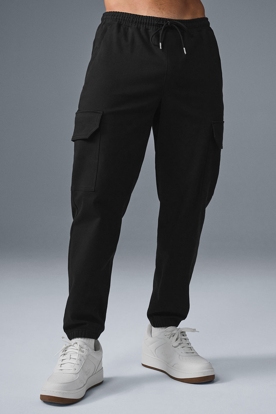 Black sueded joggers showcasing a comfortable fit and drawcord waist.