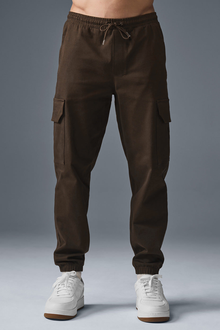 Espresso sueded joggers styled with a casual jacket.
