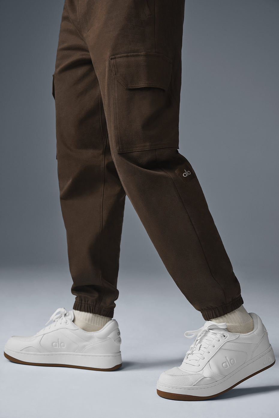 Espresso sueded joggers styled with a casual jacket.