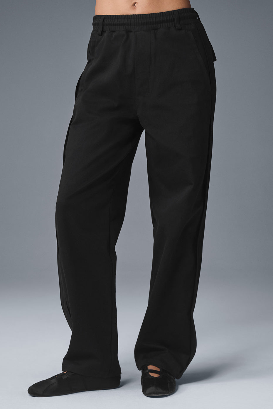 Front view of black suede pants for women, showcasing the sleek design.