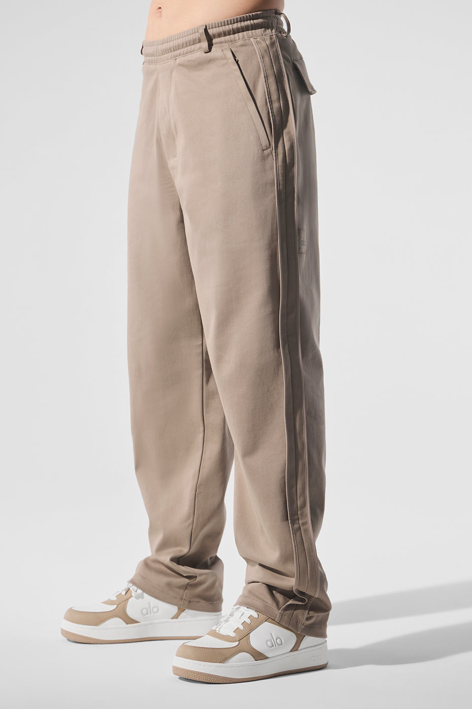 Lifestyle shot of sueded straight leg pants styled with a cozy top.