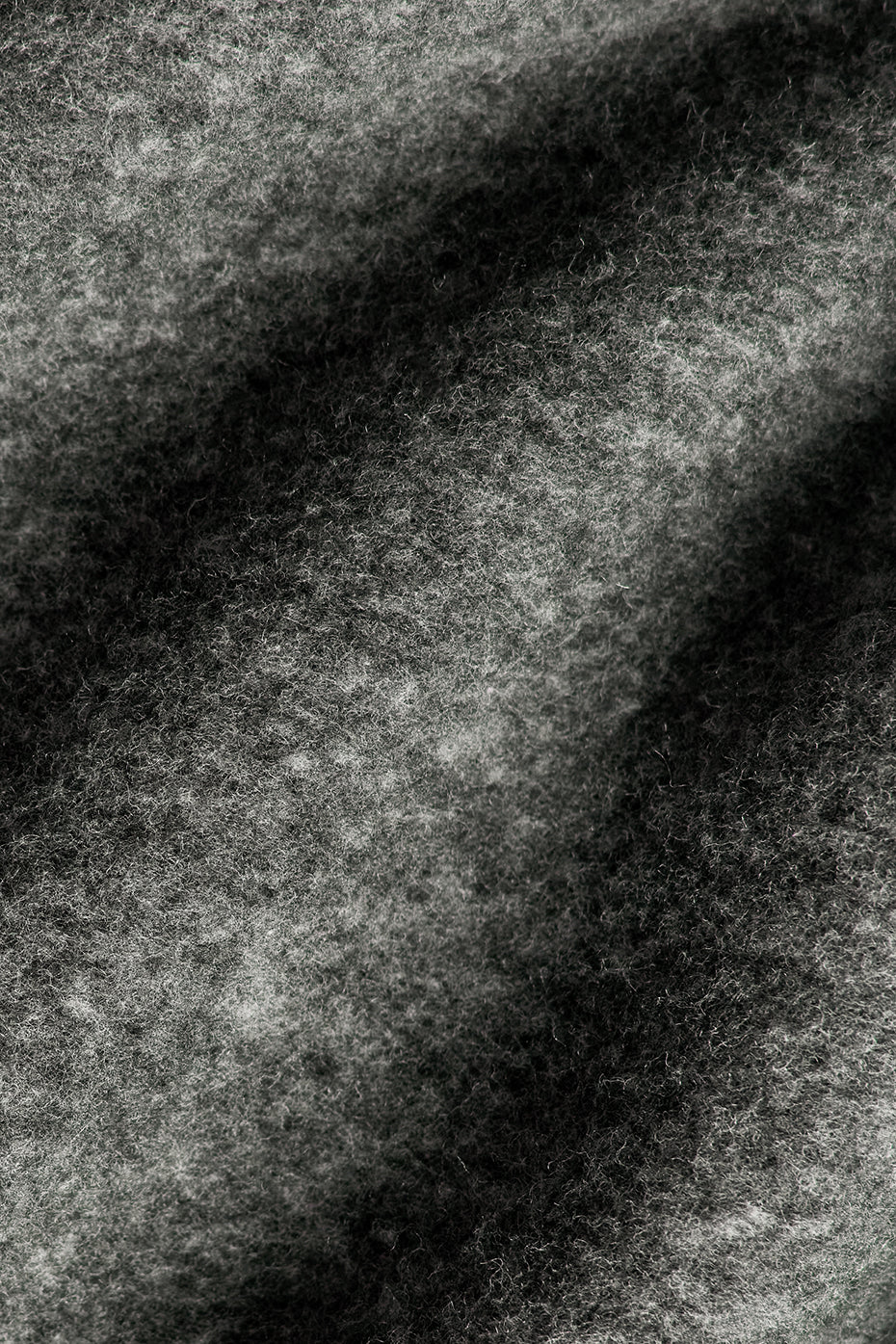 Close-up of the fleece fabric and drawcord waist on grey sweatpants