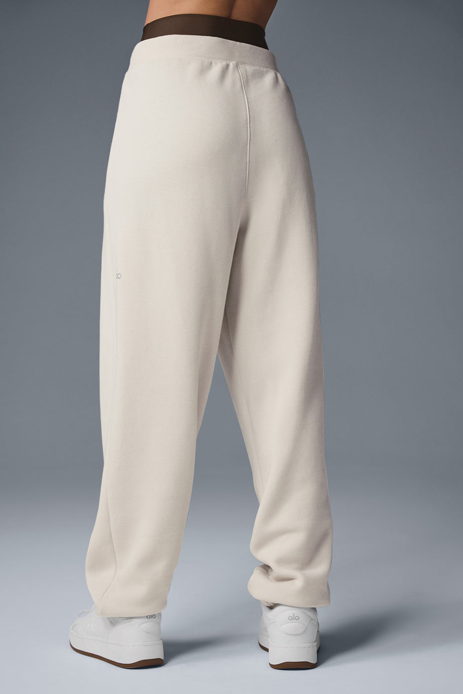 Model wearing Triumph Restore sweatpants, demonstrating their cozy and stylish design.