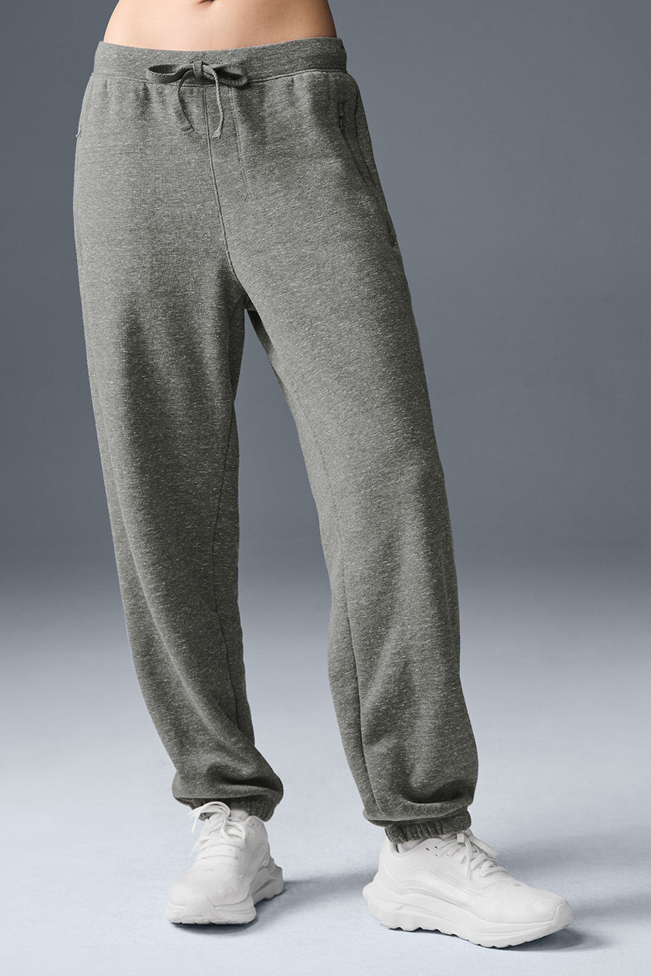 Front view of grey triblend sweatpants with wide leg fit and zip pockets