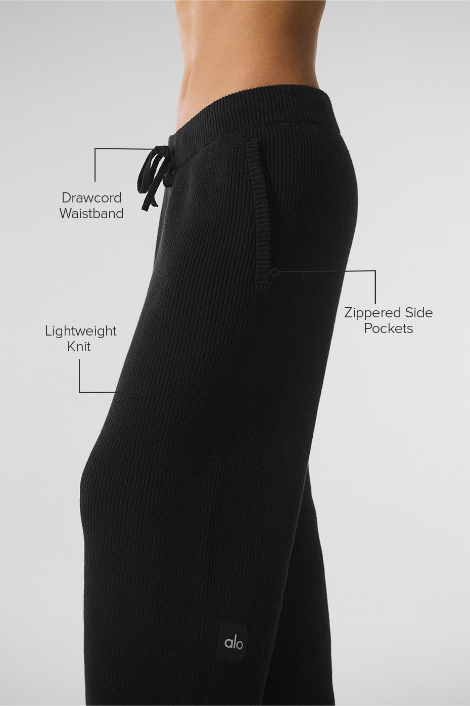 Close-up of the ribbed texture of the black joggers, perfect for a casual look.