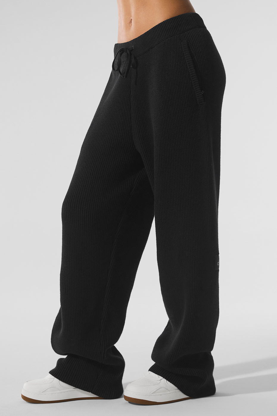 Side view of Elevate Ribbed Knit Black Joggers showcasing the drawcord waistband.