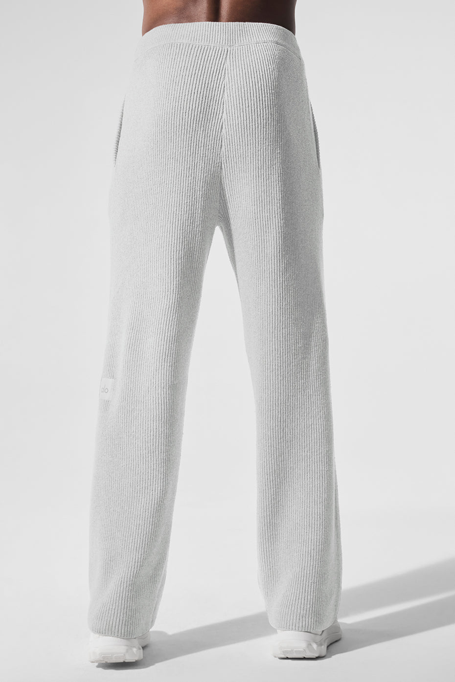 Casual styling of wide leg sweatpants in heather grey, ideal for relaxing at home.