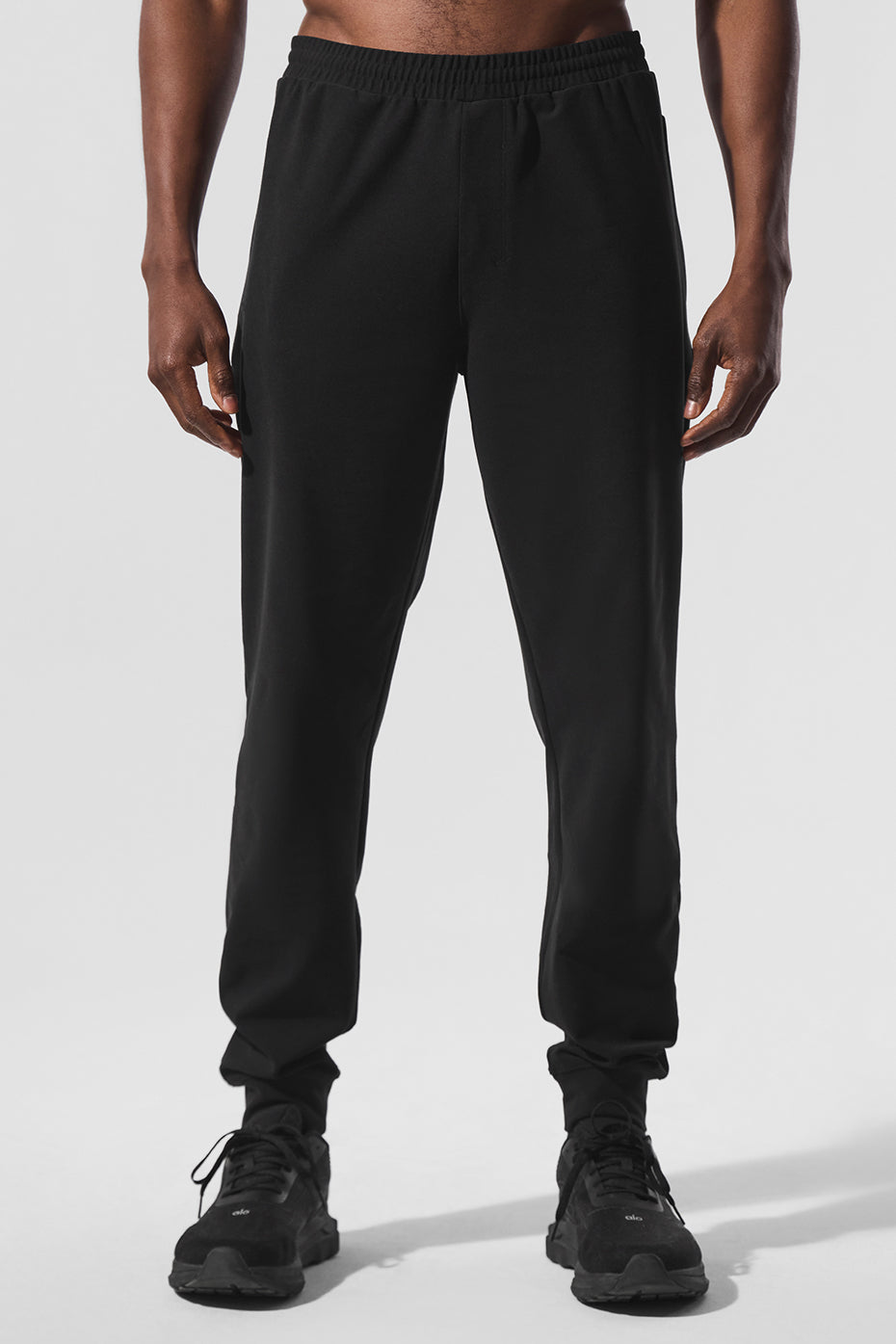 Front view of Conquer Max performance joggers for men in black.