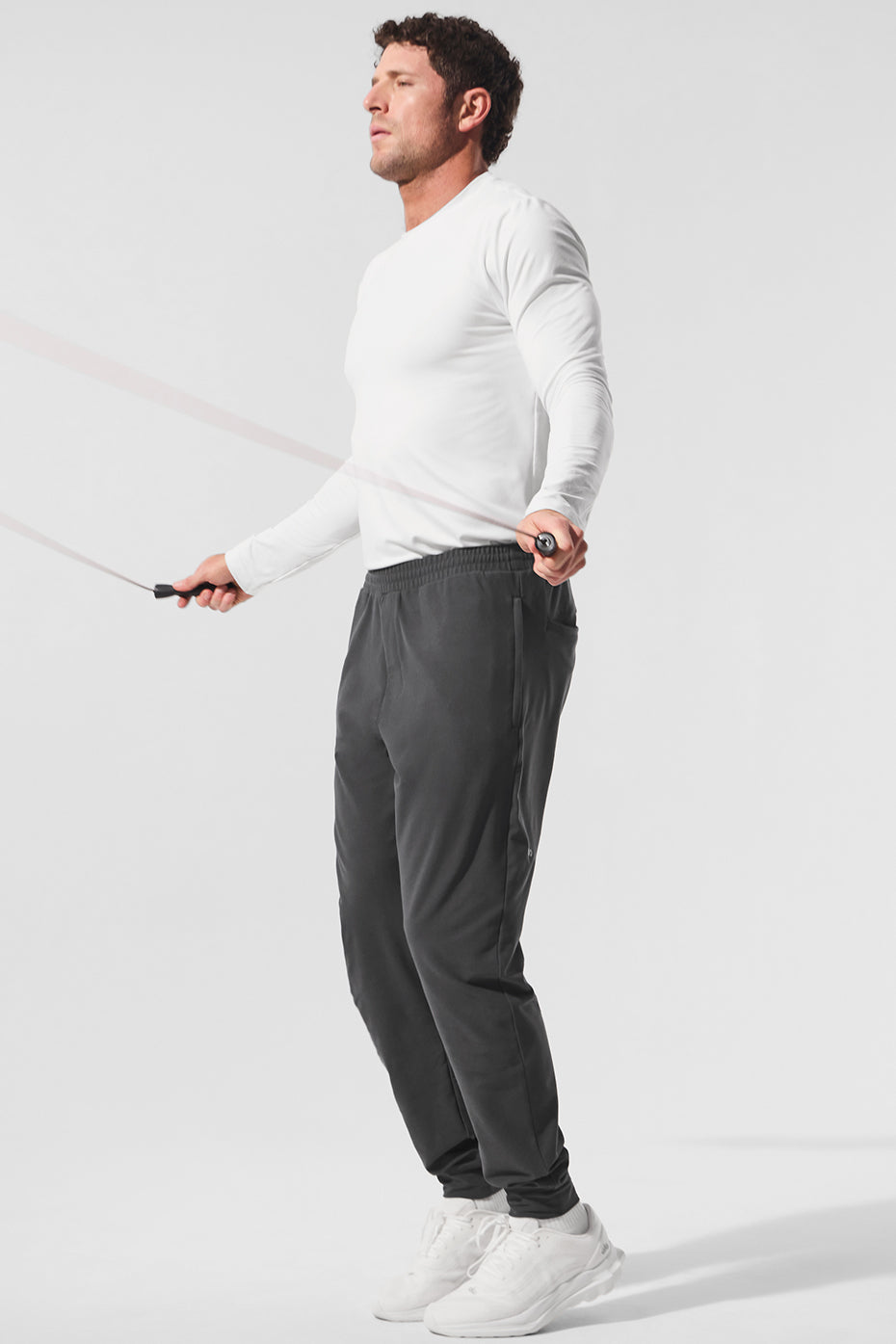 Close-up of mens performance joggers highlighting the stretch fabric and fit.