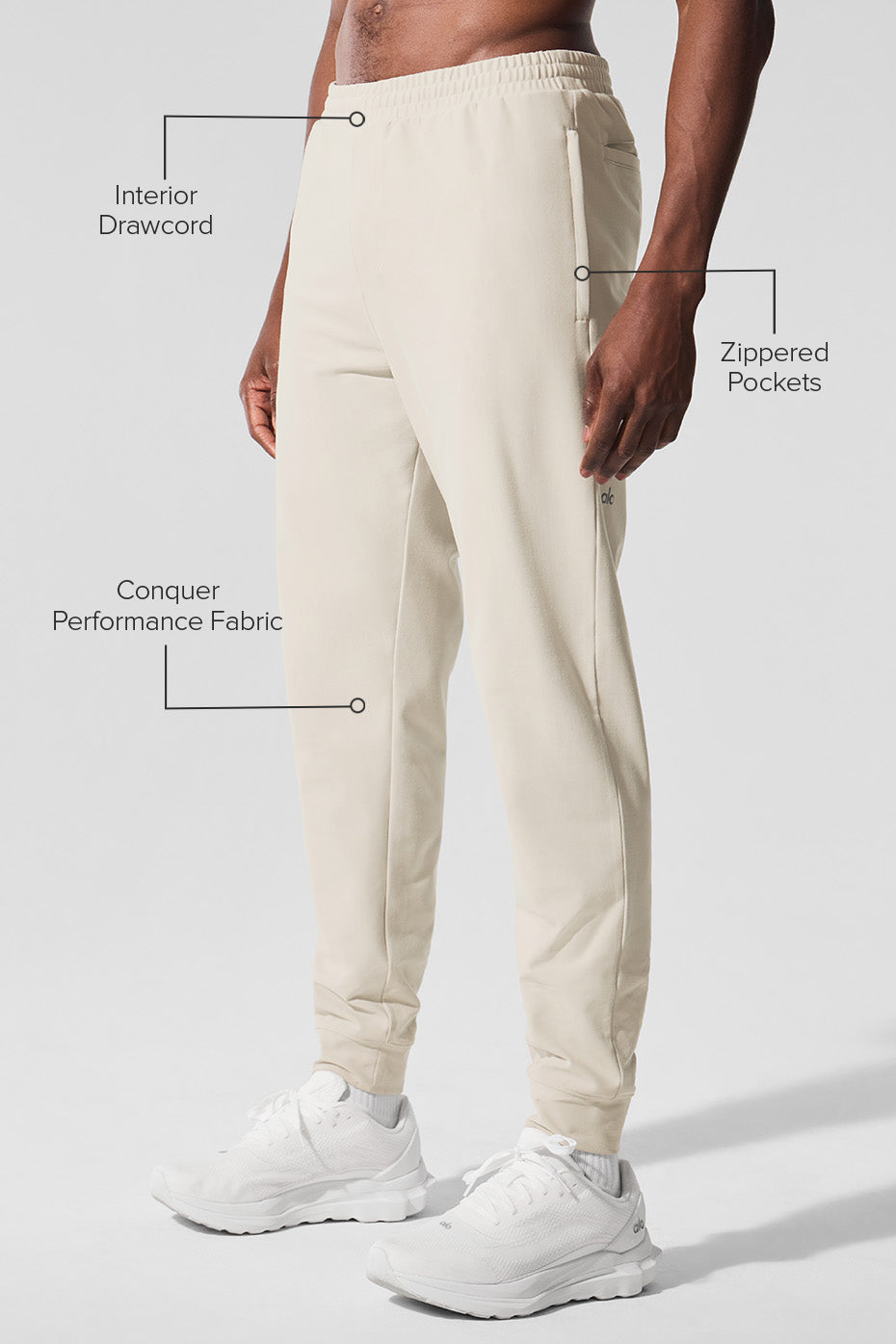 Man stretching in athletic wear performance joggers outdoors